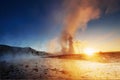 Strokkur geyser eruption in Iceland. Fantastic colors shine through the steam. Royalty Free Stock Photo