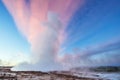 Strokkur geyser eruption in Iceland. Fantastic colors shine through the steam. Royalty Free Stock Photo