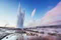 Strokkur geyser eruption in Iceland. Fantastic colors shine through the steam. Royalty Free Stock Photo