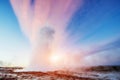 Strokkur geyser eruption in Iceland. Fantastic colors shine thro Royalty Free Stock Photo