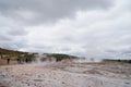 Unidentified tourists waiting for eruption of Strokkur Geysir.