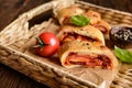 Stromboli stuffed with cheese, salami, green onion and tomato sauce Royalty Free Stock Photo