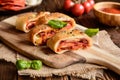 Stromboli stuffed with cheese, salami, green onion and tomato sauce Royalty Free Stock Photo