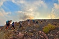 STROMBOLI VOLCANO, ITALY - AUGUST 2015: Group of tourists hiking on top of the Stromboli Volcano in the Aeolian Islands, Sicily, I Royalty Free Stock Photo