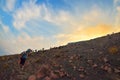 STROMBOLI VOLCANO, ITALY - AUGUST 2015: Group of tourists hiking on top of the Stromboli Volcano in the Aeolian Islands, Sicily, I Royalty Free Stock Photo