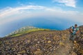 STROMBOLI VOLCANO, ITALY - AUGUST 2015: Group of tourists hiking on top of the Stromboli Volcano in the Aeolian Islands, Sicily, I Royalty Free Stock Photo