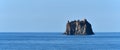 Strombolicchio, cliff with lighthouse, near Stromboli volcano, calm sea surface, Italy, Europe