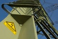Electricity pylon with warning notice in German