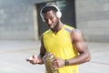 Strong african man drinking water after workout. Looking at came Royalty Free Stock Photo