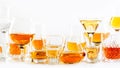 Strong alcohol drinks, hard liquors, spirits and distillates iset in glasses: cognac, scotch, whiskey and other. White background Royalty Free Stock Photo