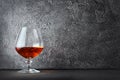 Strong alcoholic drink cognac in sniffer glass with copy space