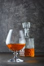 Strong alcoholic drink cognac in sniffer glass and crystal decanter