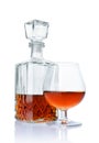 Strong alcoholic drink cognac in sniffer glass and crystal decanter Royalty Free Stock Photo