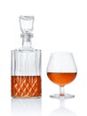 Strong alcoholic drink cognac in sniffer glass and crystal decanter Royalty Free Stock Photo