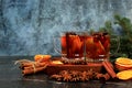 Strong alcoholic or non-alcoholic cocktail, mulled wine with spices, star anise, cranberry and cinnamon, warming winter drink