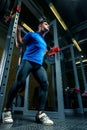 Strong athlete in training in the gym, a man raises a heavy barb Royalty Free Stock Photo