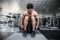 Strong Athletic Asian Man workout with dumbbell curl Concentration muscle on shoulder abd back for bodybuilding