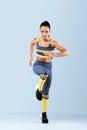 A strong athletic, women sprinter, running wearing in the sportswear, fitness and sport motivation. Runner concept with Royalty Free Stock Photo