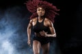 A strong athletic, female sprinter, running at sunrise wearing in the sportswear, fitness and sport motivation concept Royalty Free Stock Photo