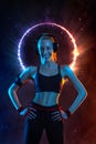 Strong athletic fit woman on black with neon lights background wearing in the sportswear. Fitness and sport motivation. Royalty Free Stock Photo