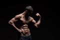 Strong athletic man on black background Royalty Free Stock Photo