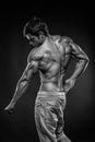 Strong Athletic Man Fitness Model posing back muscles, triceps, Royalty Free Stock Photo