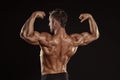 Strong Athletic Man Fitness Model posing back muscles, triceps, Royalty Free Stock Photo