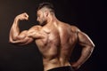 Strong Athletic Man Fitness Model posing back muscles, triceps, Royalty Free Stock Photo