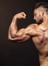 Strong Athletic Man Fitness Model posing back muscles, triceps,