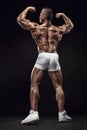Strong Athletic Man Fitness Model Posing Back Muscles, Triceps,