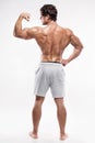 Strong Athletic Man Fitness Model posing back muscles, triceps, Royalty Free Stock Photo