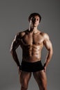 Strong Athletic Man showing muscular body and sixpack abs. Showing his body. FITNESS MODEL. Great for Underwear Commercial. Wet b Royalty Free Stock Photo