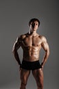 Strong Athletic Man showing muscular body and sixpack abs. Showing his body. FITNESS MODEL. Great for Underwear Commercial. Wet b Royalty Free Stock Photo