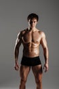 Strong Athletic Man showing muscular body and sixpack abs. Showing his body. FITNESS MODEL. Great for Underwear Commercial. Wet b Royalty Free Stock Photo