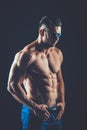 strong athletic man in sunglasses on black background Royalty Free Stock Photo