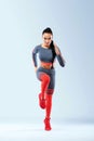 A strong athletic, women sprinter, running wearing in the sportswear, fitness and sport motivation. Runner concept with Royalty Free Stock Photo