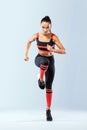 A strong athletic, women sprinter, running wearing in the sportswear, fitness and sport motivation. Runner concept with Royalty Free Stock Photo