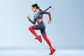 A strong athletic, women sprinter, running wearing in the sportswear, fitness and sport motivation. Runner concept with Royalty Free Stock Photo