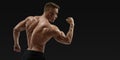 Strong back of a athletic muscular man flexing his arms Royalty Free Stock Photo