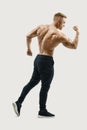 Strong back of a athletic muscular man flexing his arms Royalty Free Stock Photo