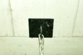 Strong black steel plate bolted in to the ceiling as heavy duty holder of boxing sack.