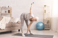 Senior lady exercising with dumbbells at home Royalty Free Stock Photo