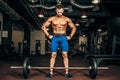 Strong Bodybuilder preparing for deadlift of barbell Royalty Free Stock Photo