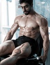 Strong bodybuilder training quads Royalty Free Stock Photo