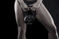 Strong bodybuilder woman holding kettlebell isolated