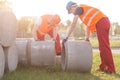 Strong builders with concrete tubes Royalty Free Stock Photo