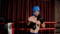 Strong Caucasian sport boxer warming up to prepare for boxing in the boxing ring. intimidate an opponent Build up your self-