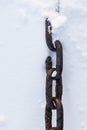 Strong chain in snow close-up