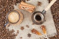 Strong coffee with foam, cinnamon, sugar stick, nutmeg on the bu Royalty Free Stock Photo