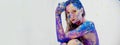 Strong colored portrait, head resting on arm, with blue purple magenta bodypainting, facepainting, sexy brunette woman, painted